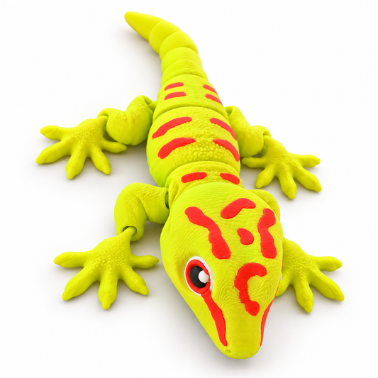 Articulated 3D-printed Day Gecko in neon yellow-green with red markings on a clean white studio background